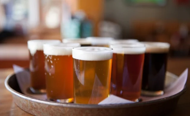 Close up of a tray of pints in a pub