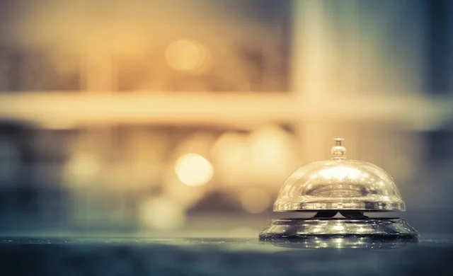 Close up of a bell on a counter in a hospitality venue