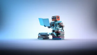 small robot reading a manual