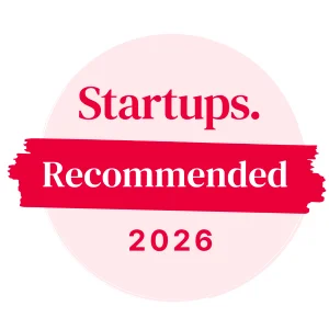 The Startups "Recommended" award is a pink circle with a brushstroke in the center displaying the words "Recommended", with the Startups logo on top, and the year 2026 at the bottom.