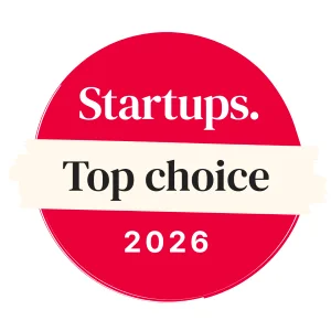 The Startups "Top choice" award is a red circle with a yellow brushstroke in the center displaying the words "Top choice", with the Startups logo on top, and the year 2026 at the bottom.