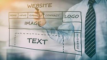Mid shot of a business man in shirt and tie overlaid by a hand drawn plan of a website homepage.