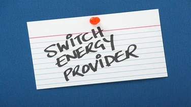 note with "switch energy provider" pinned to a board