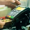 Payment terminal processing a contactless card transaction.