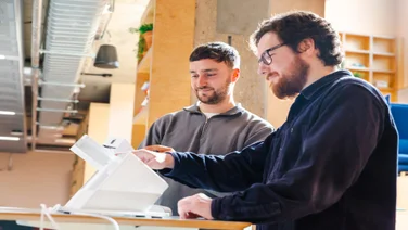 The Senior Research Executive and Reviews Writer testing a POS terminal