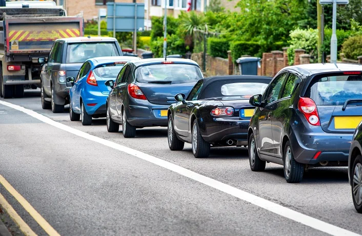 heavy traffic jam next to bus lane in england uk
