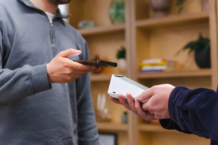 The Square Terminal being used to take a payment in the Startups offices