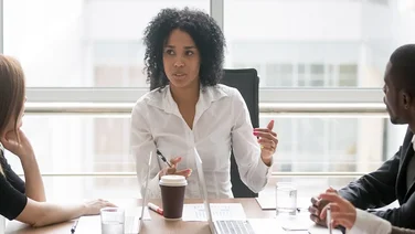 LEEP woman boss hosting a meeting