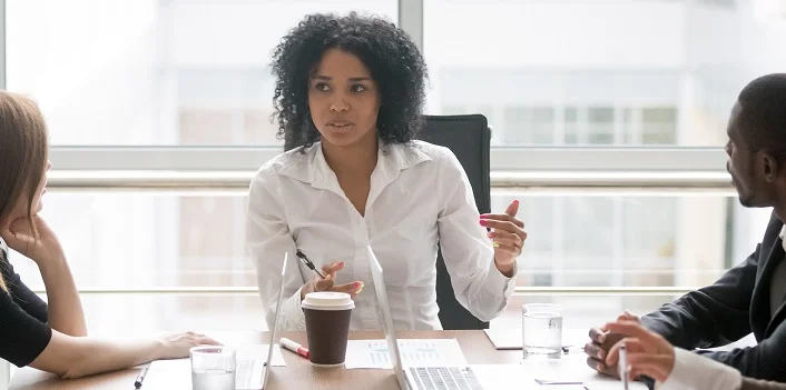 LEEP woman boss hosting a meeting