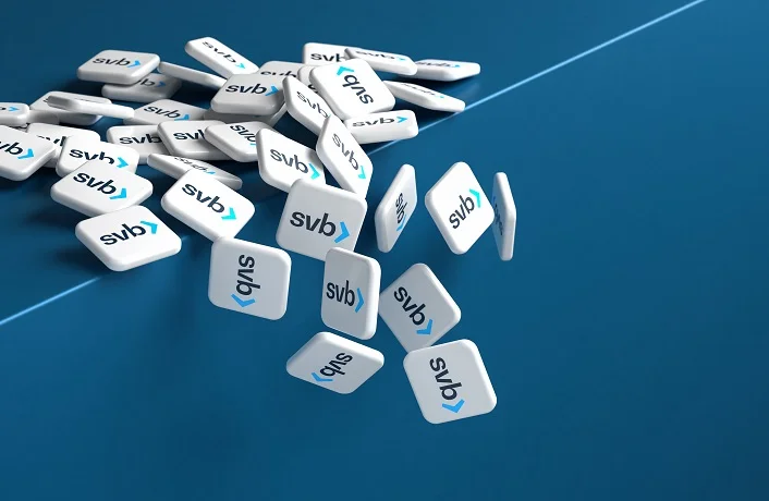 Concept: The demise of the bank for financing startup companies Silicon Valley Bank SVB. Logos of SVB falling over an edge / cliff