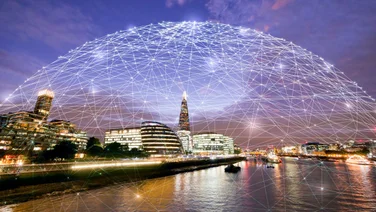 wide shot of tech city by a river
