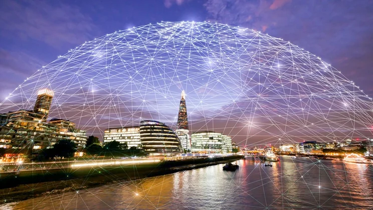 wide shot of tech city by a river