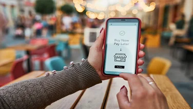BNPL Buy now pay later online shopping service on smartphone. Online shopping. Paying after delivery. Complete the payment after purchase at no added cost. Payment after credit check. Easy way to shop online. Afterpay service