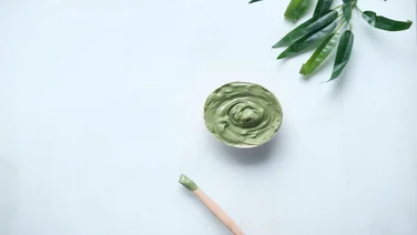 overhead photo of a pot of skin care product