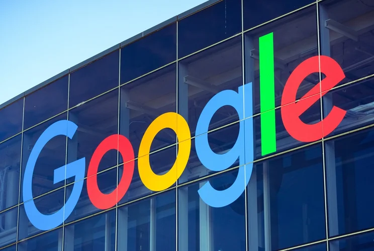 A shot of the outside of Google's office, with the logo displayed prominently.