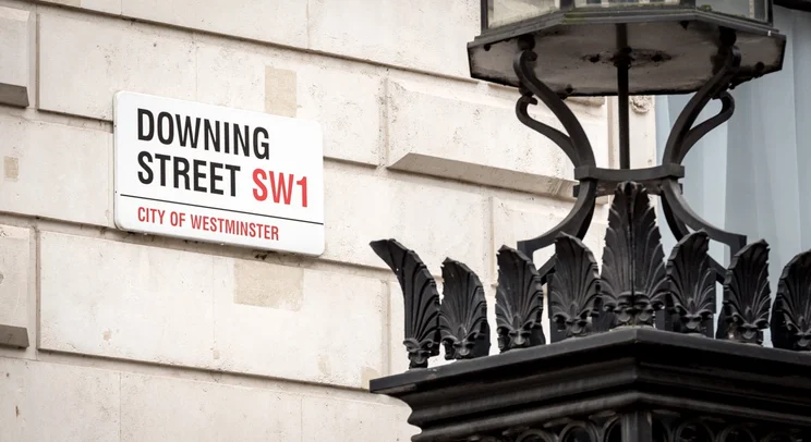 a street sign for Downing Street