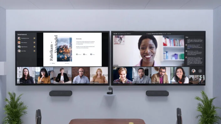 Microsoft Teams dual monitor setup showing video meeting with participants and shared documents