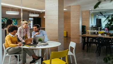 Group of colleagues doing business at a cafe