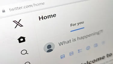 San Francisco, California - 2023: Twitter website UI is updated with new X logo after Elon Musk's rebranding in 2023, closeup page displayed on a computer screen