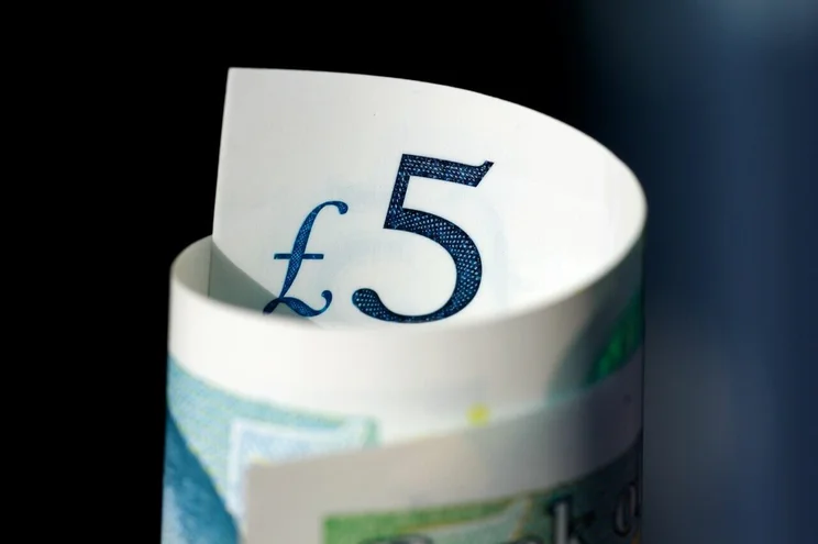 A rolled up &pound;5 note