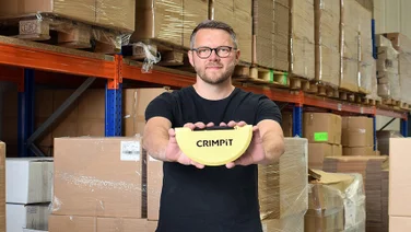 Mike Harper holding a CRIMPiT toasted sandwich maker