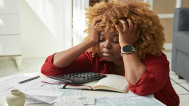 Business debt stressed out looking business owner frets over bills
