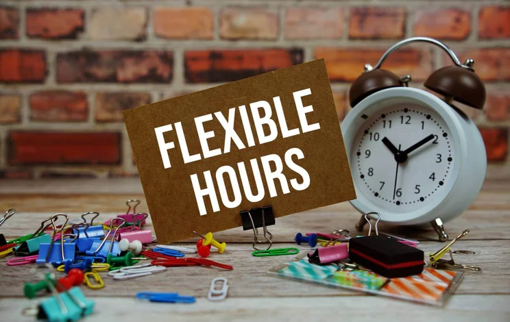 Sign reading "Flexible hours" beside a clock