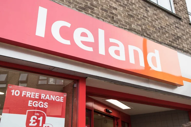Shot outside of an Iceland supermarket with its logo prominently displayed.