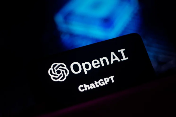 A black card displaying the OpenAI logo with a blue backdrop.