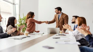 Leaders CEO bosses shaking hands boardroom office