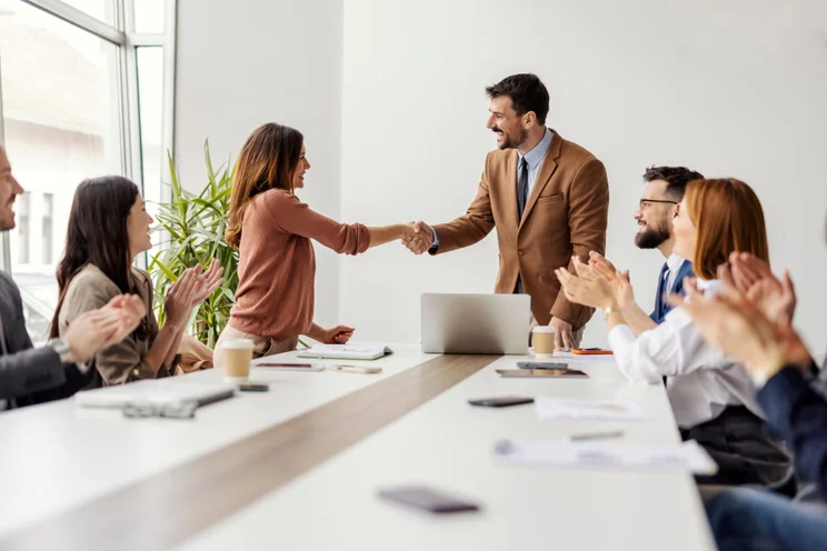 Leaders CEO bosses shaking hands boardroom office