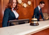 A hotel staff member at the front desk.