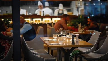 An empty table at a restaurant that could be booked by Google.