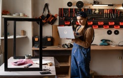A builder uses the Startup Business Toolkit in her tool shed.