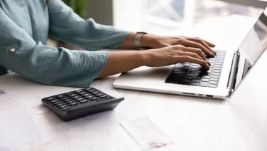 self-employed worker filing invoices