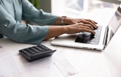 self-employed worker filing invoices
