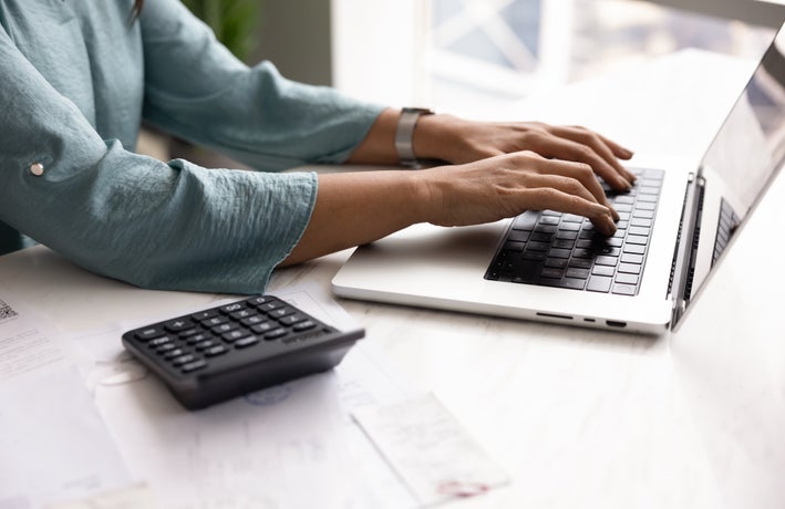 self-employed worker filing invoices
