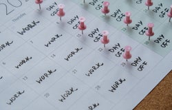 A calendar showing days at work and days off work.